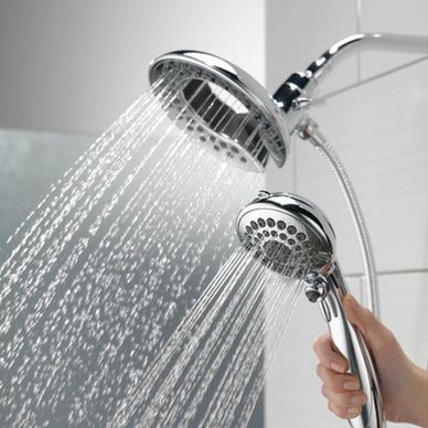 Multi-function handheld shower sprayer installed with a bathtub to shower conversion installation.