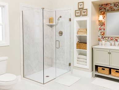 Bath remodel of corner shower conversions with marble shower wall surround.
