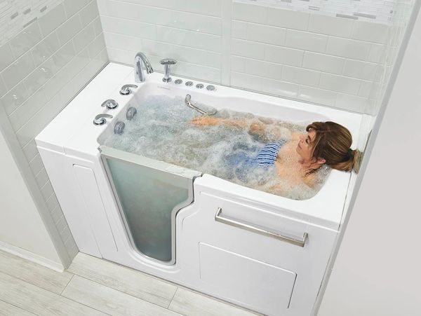 Enjoying the hydro-massage in walk in bathtub from Ella's Bubbles installed by Mobility Bath Systems