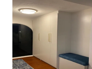 home foyer, flush mount ceiling light, coat cabinets and bench with blue cushion