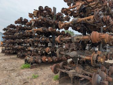 Stacks of vehicle axles.