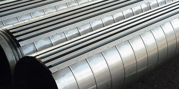 Stainless steel spiral duct with surface mountd linear diffusers.