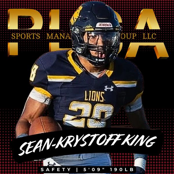 Sean-Krystoff King, football safety, in uniform carrying a football.