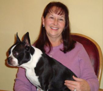 Dog walker, Donna Deitz, with her boston terrier, Spooner.