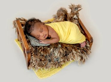 A sleeping black/African American baby.