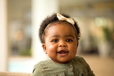 Happy Black/African American infant.