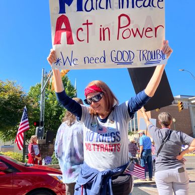 Woman holding protest sign