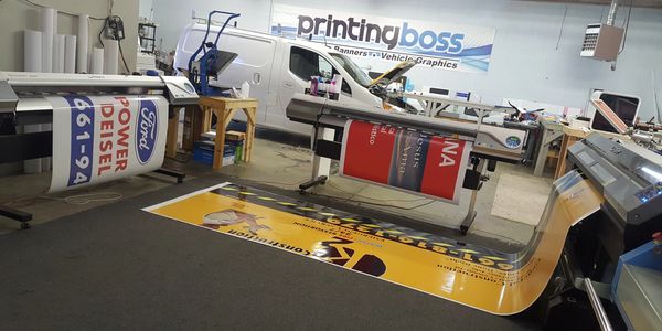 Professional large-format printing in progress, producing durable signs, banners, and vehicle wrap