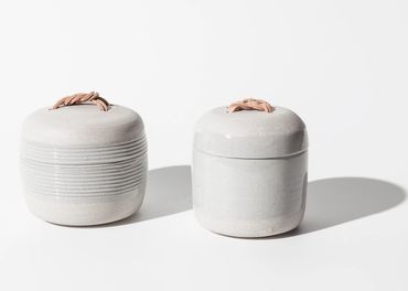 stoneware jars with leather knots