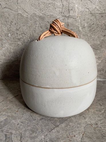 Stoneware jar with leather knot