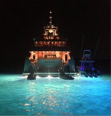 Underwater lights on a yacht.in the ocean in the dark