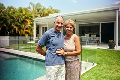 Happy Homeowners in their home that has been deeded into a lady bird deed.