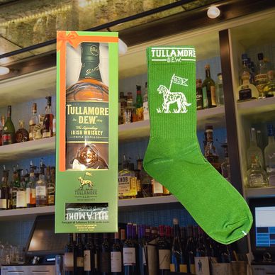 Whiskey bottle in packaging and a pair of socks