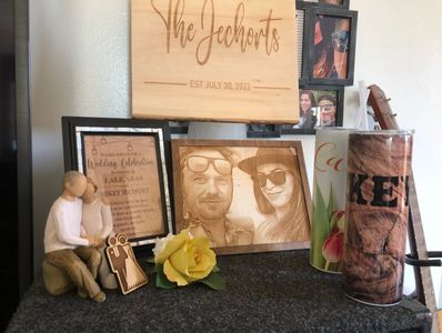 This is a sample of products  with a wooden engraved photo, wooden invitation, and custom sign.