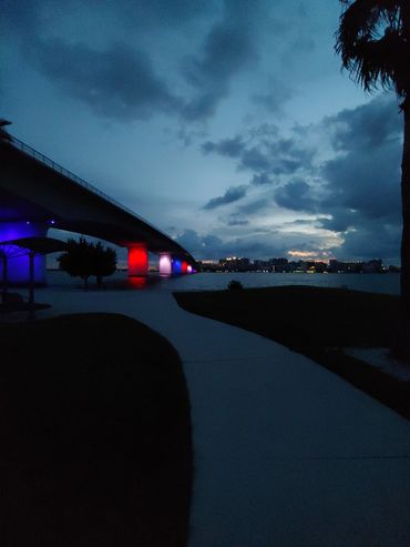 brant-crockett-looking-at-led-lights-on-ringling-bridge-at-sunrise