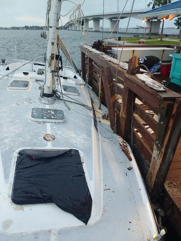 robert-brant-crockett-looking-at-crashed-sailboat