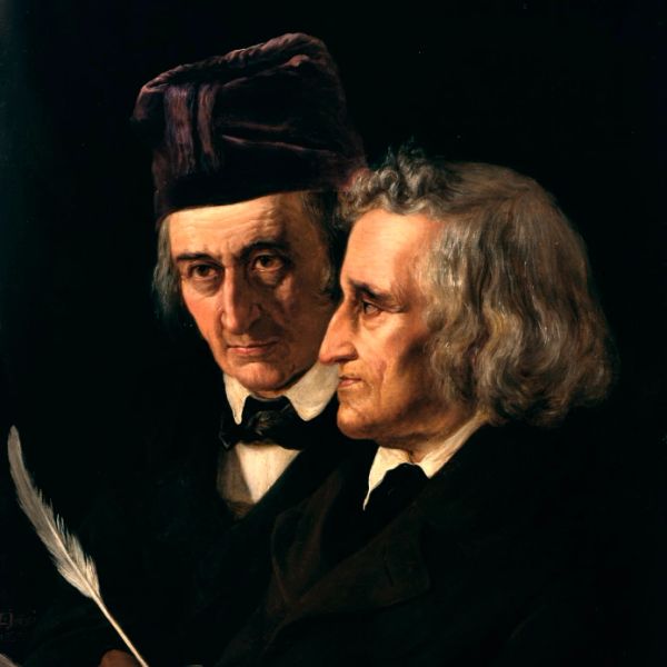 Portrait of two elderly men in dark clothing, one holding a quill pen.