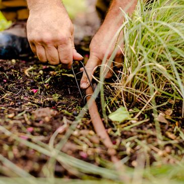 licensed irrigator makes sprinkler system repairs