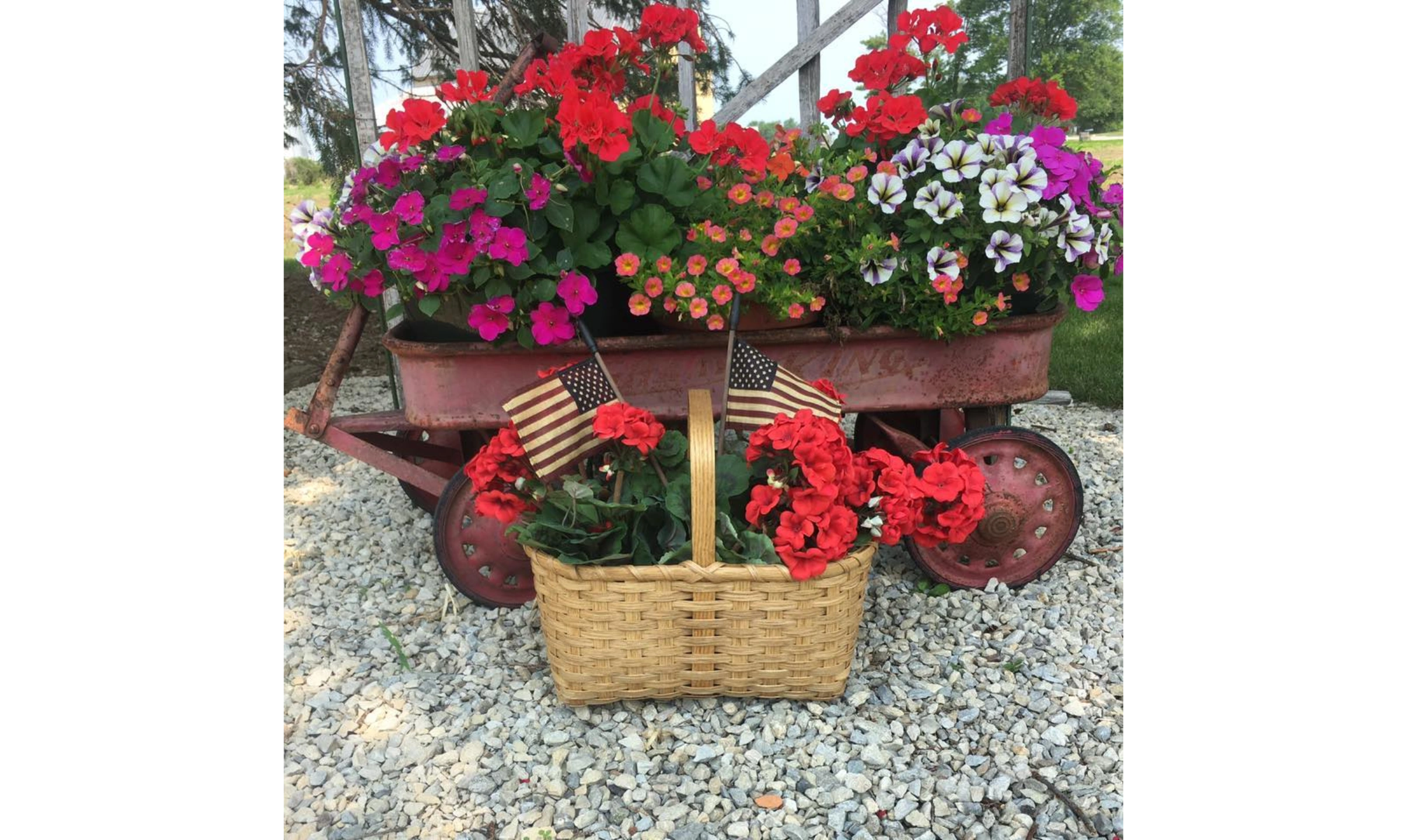 Wagon with flowers and basket with flowers and American Flags.