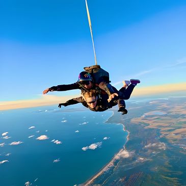 Sunset tandem skydive over the coastline