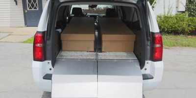 Two coffins inside the car