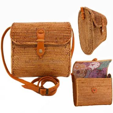 Brown woven crossbody bag with leather strap and clasp.