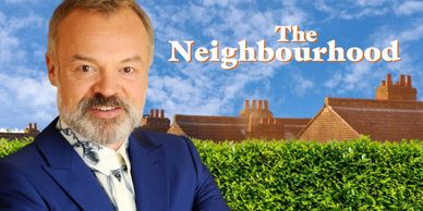 Host stands in front of suburban homes for The Neighbourhood show.