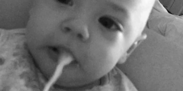 Baby being sick