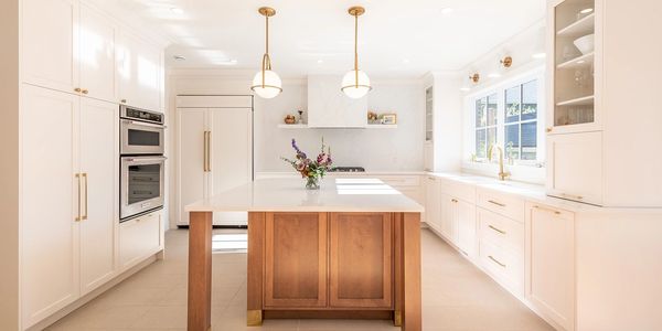 Bright and spotless kitchen with gleaming surfaces, showcasing a fresh and tidy space.