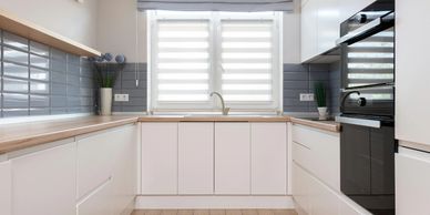 Spotless kitchen with gleaming surfaces, showcasing the results of our regular home cleaning service