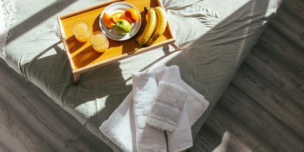Fresh fruit and neatly rolled towels, showcasing the care of our Airbnb turnover service.