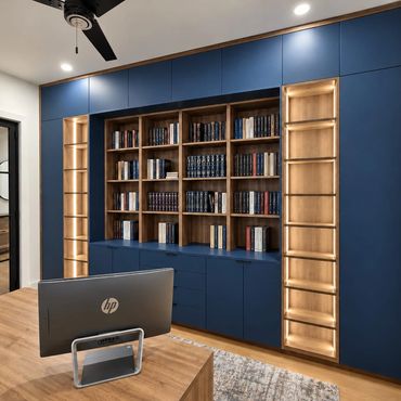 Modern office space with blue bookshelves and wooden accents.