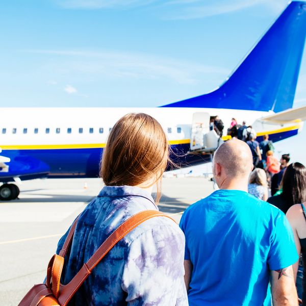 PEople boarding airplane