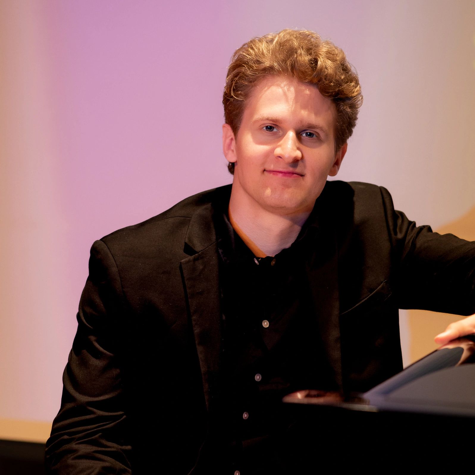 Dominik Yoder sitting at the piano.