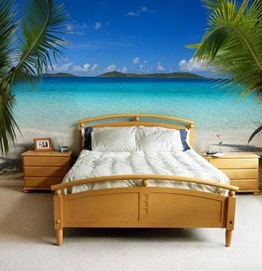 Tropical-style bedroom with a beach view and bamboo bed