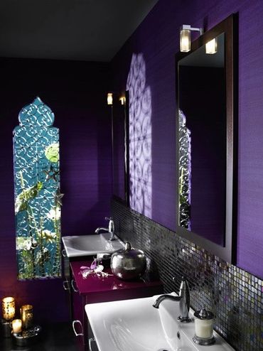 Purple-themed bath with dramatic lighting and ornate decor