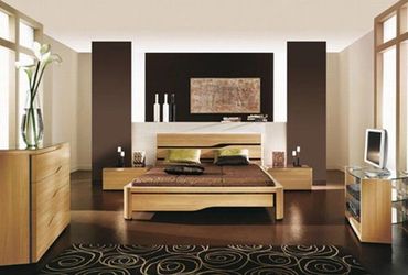 Warm-toned bedroom with wooden elements and clean lines