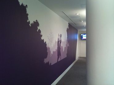 Hallway with purple shadow-themed wall mural