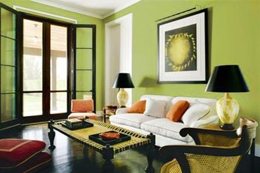 White antique armchair against a patterned wall