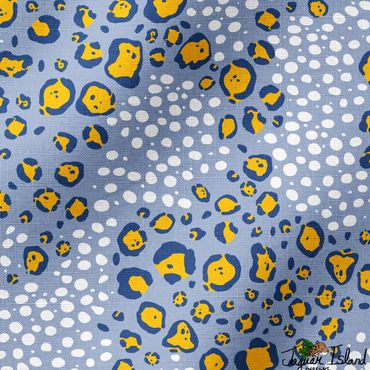 Yellow jaguar or leopard spots mixed with white cheetah spots to make an abstract pattern