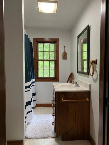 Upstairs bathroom in hallway.