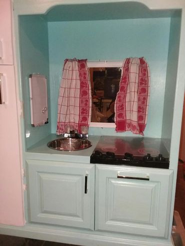 ENTERTAINMENT CENTER
TURNED INTO KITCHEN