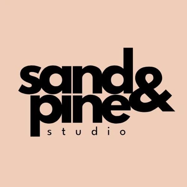 Bold black text logo saying 'sand & pine & studio' on a light brown background.