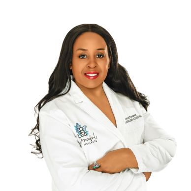 Professional woman in a white wellness coat.