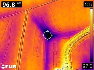 As shown in our infrared image, we discovered a water leak above the garage ceiling from above.
