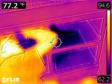 Rodney discovered a water leak behind the cabinet, as shown in the infrared image.