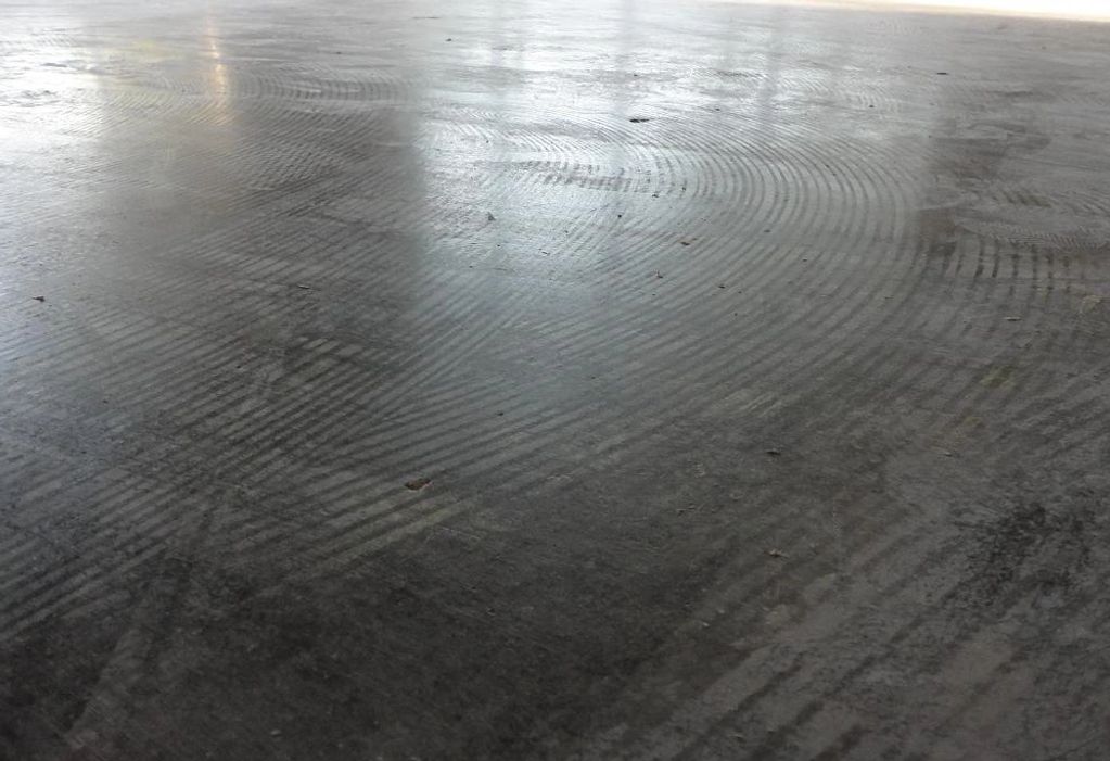Bare concrete slab after thin set removal