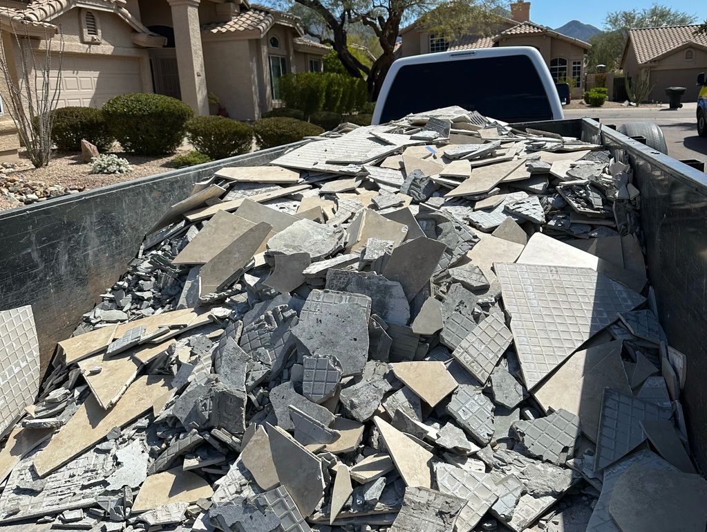 Broken tile debris hauling away