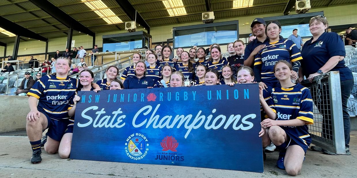 Youth rugby team celebrates NSW Junior Rugby Union State Championship.