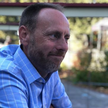 This image of Dean Campbell shows him listening and thinking about his relationships through therapy